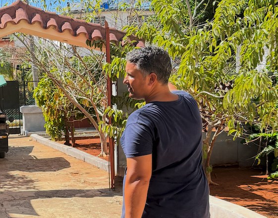 Charlie Coe walking through the church courtyard in Havana, Cuba