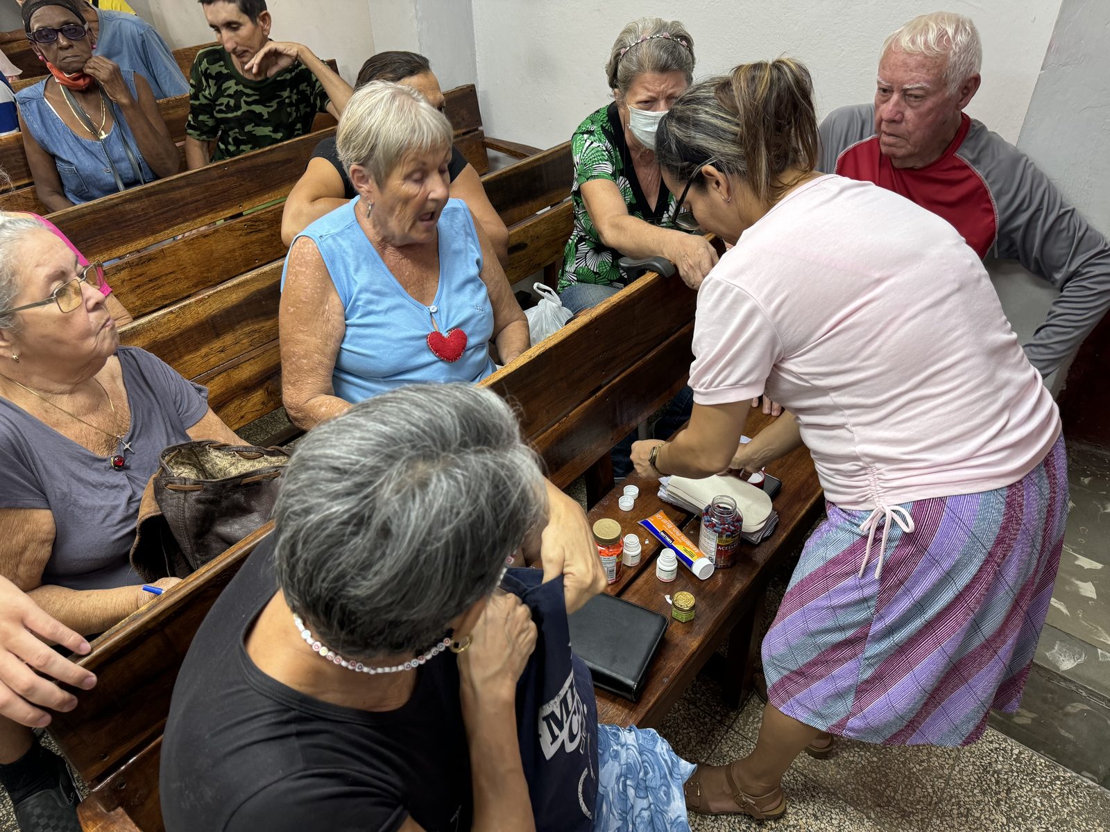 Volunteers distributing medicine and supplies to elderly church members in Cuba